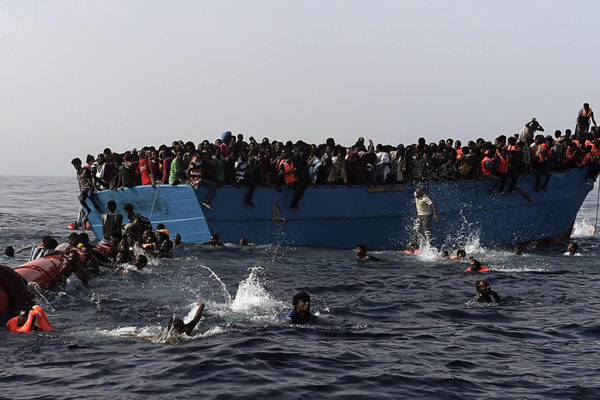 AFP PICTURES OF THE YEAR 2016
Migrants wait to be rescued by members of Proactiva Open Arms NGO in the Mediterranean Sea, some 12 nautical miles north of Libya, on October 4, 2016.
At least 1,800 migrants were rescued off the Libyan coast, the Italian coastguard announced, adding that similar operations were underway around 15 other overloaded vessels. / AFP PHOTO / ARIS MESSINIS